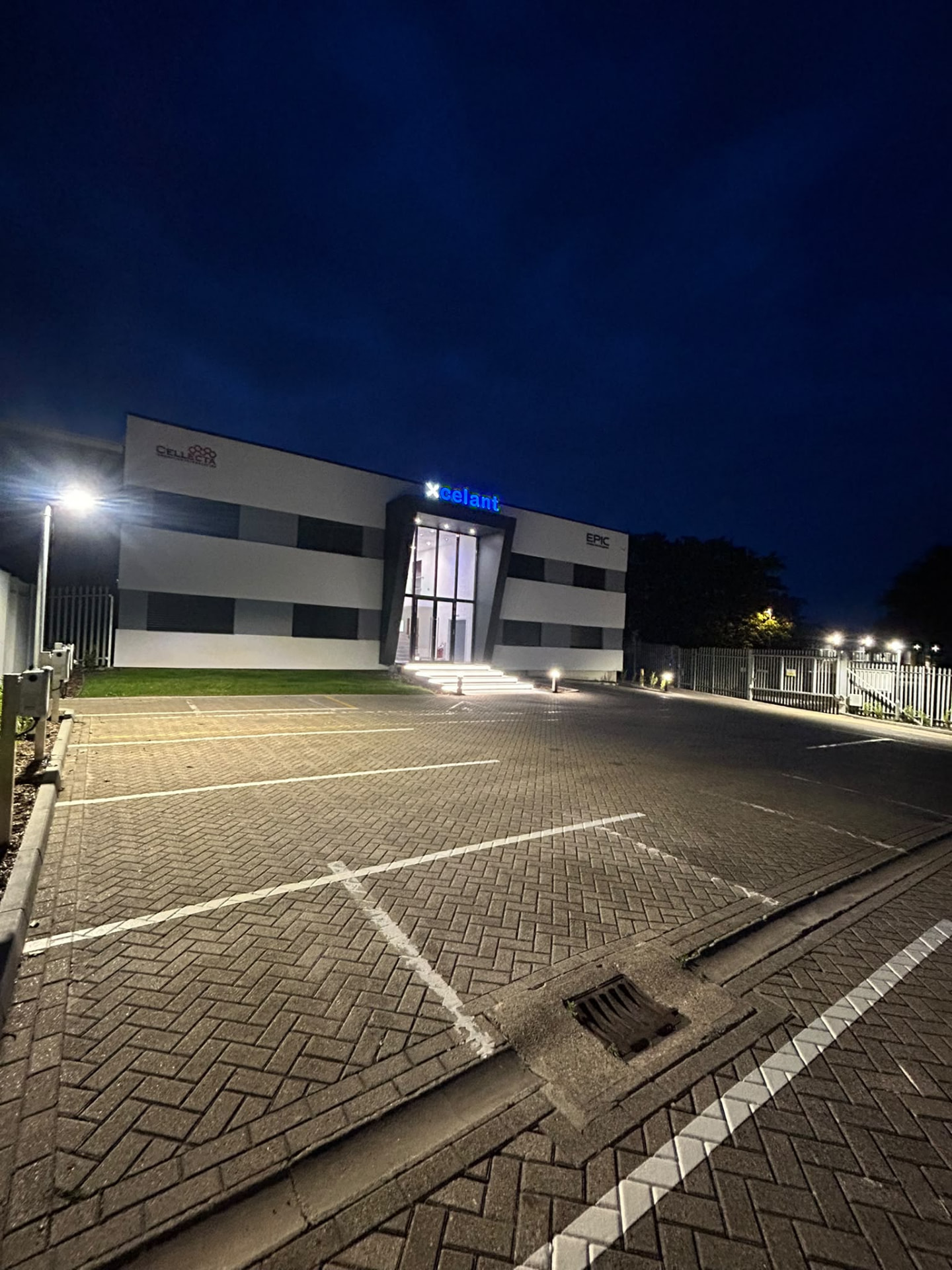 Wide night view of completed commercial premises and car park in Kent