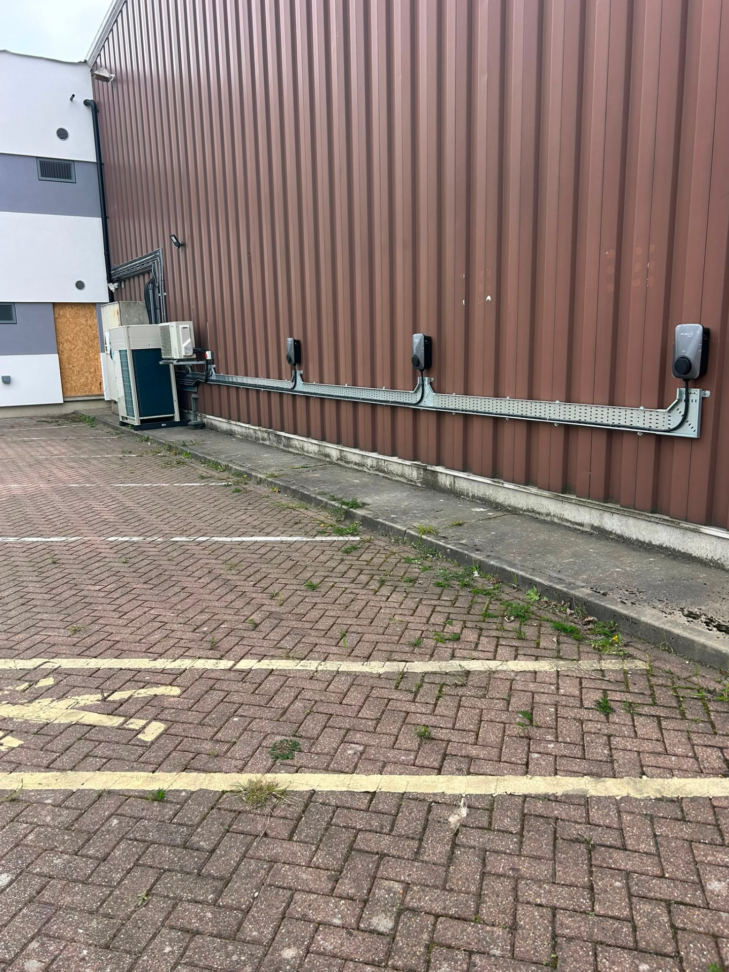 Bank of commercial EV charge points installed in a workplace car park