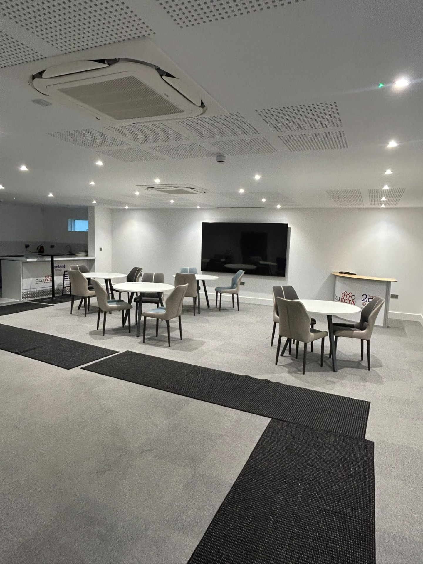 Commercial canteen and breakout area with recessed ceiling lights
