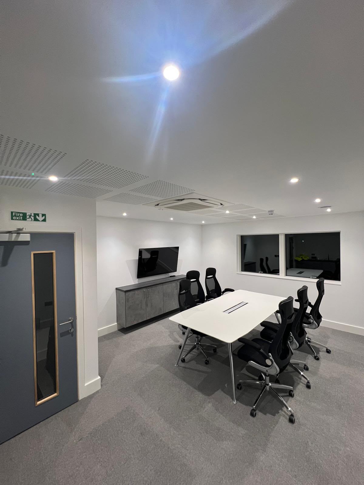 Completed boardroom in a Kent commercial property with recessed LED lighting