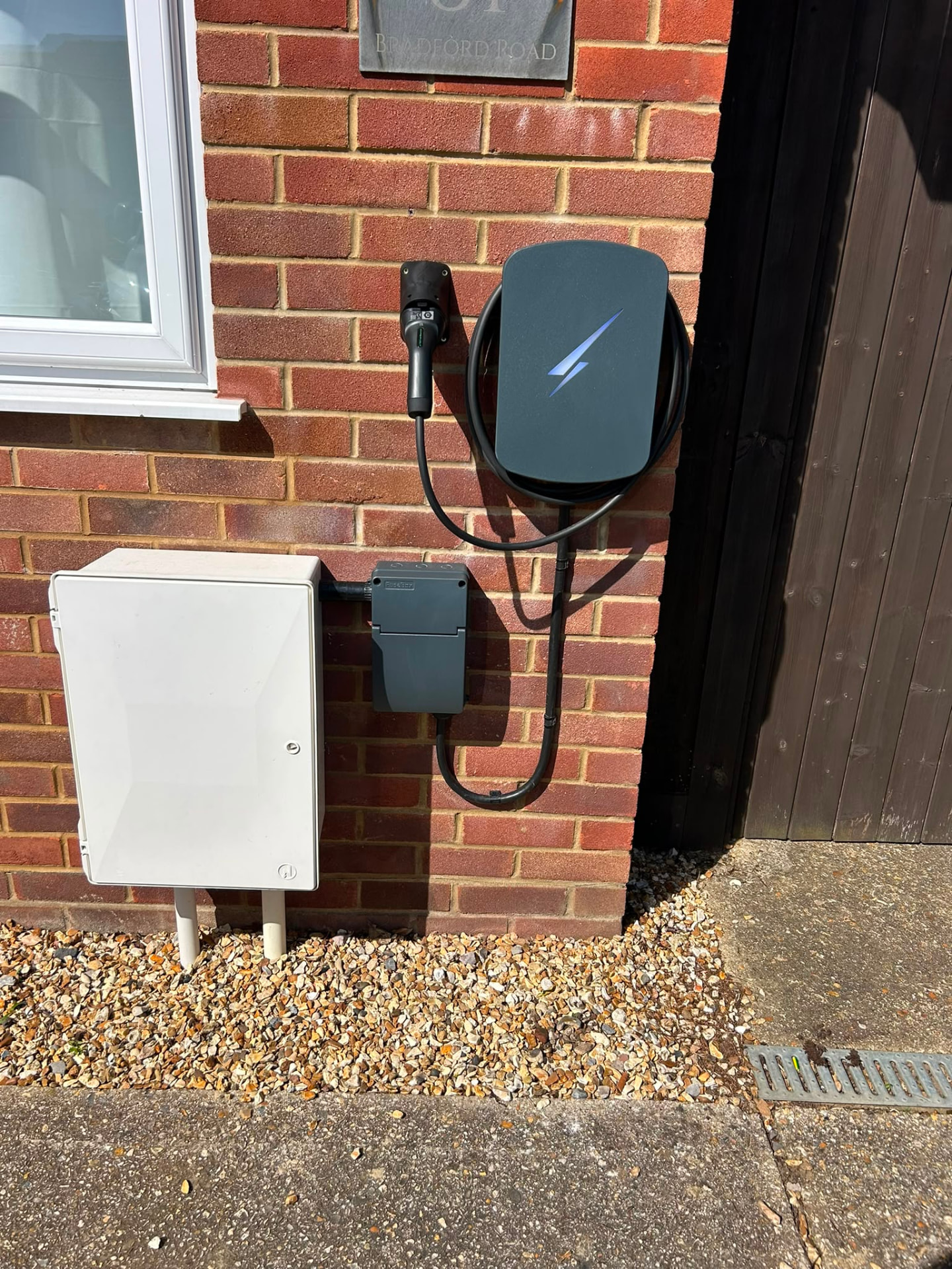 Wall-mounted home EV charge point installed on a domestic property on the South Coast
